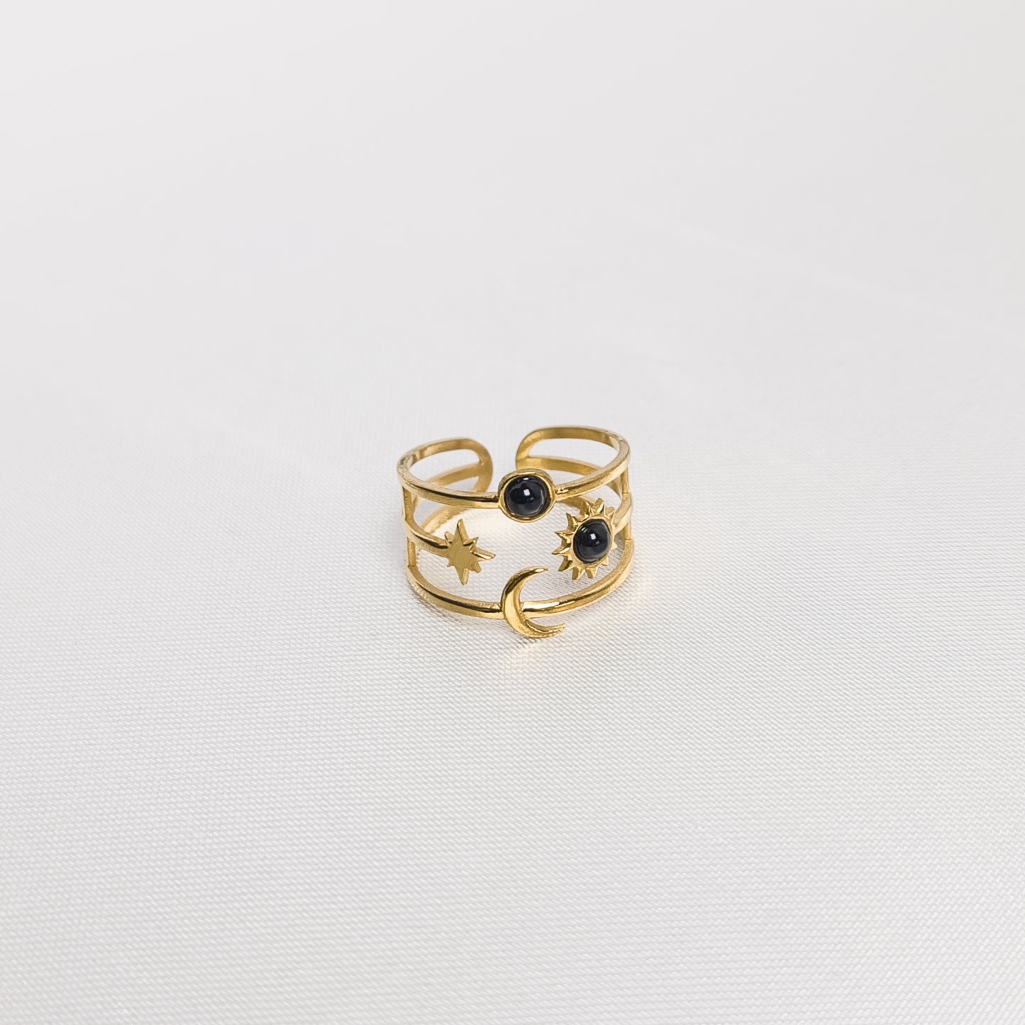 Bague Davina noire, en acier inoxydable doré et argenté, disponible à Paris.