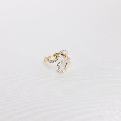 Bague Iris, en acier inoxydable doré, disponible à Paris.